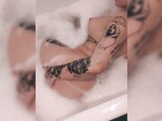 Hot tattooed female partner swallowing penis in bathroom