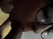 Breathtaking woman with glasses takes a fast facial cumshot